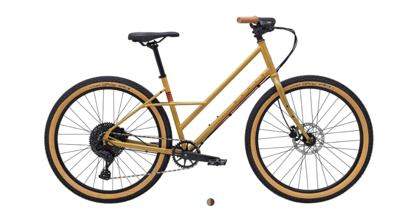 A yellow bicycle is sitting on a white surface.