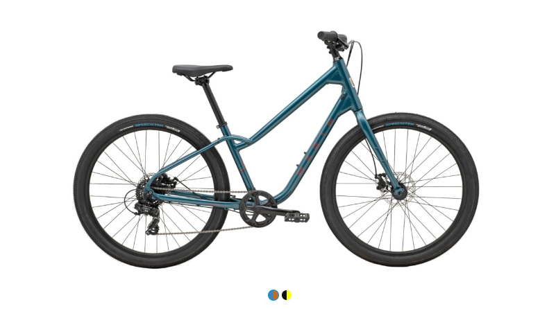 A blue bicycle is sitting on a white surface.