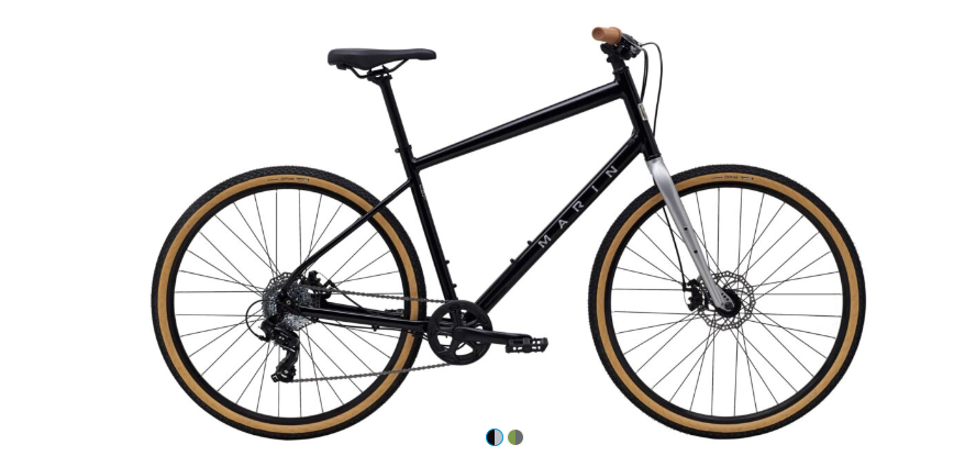 A black bicycle with brown tires on a white background.
