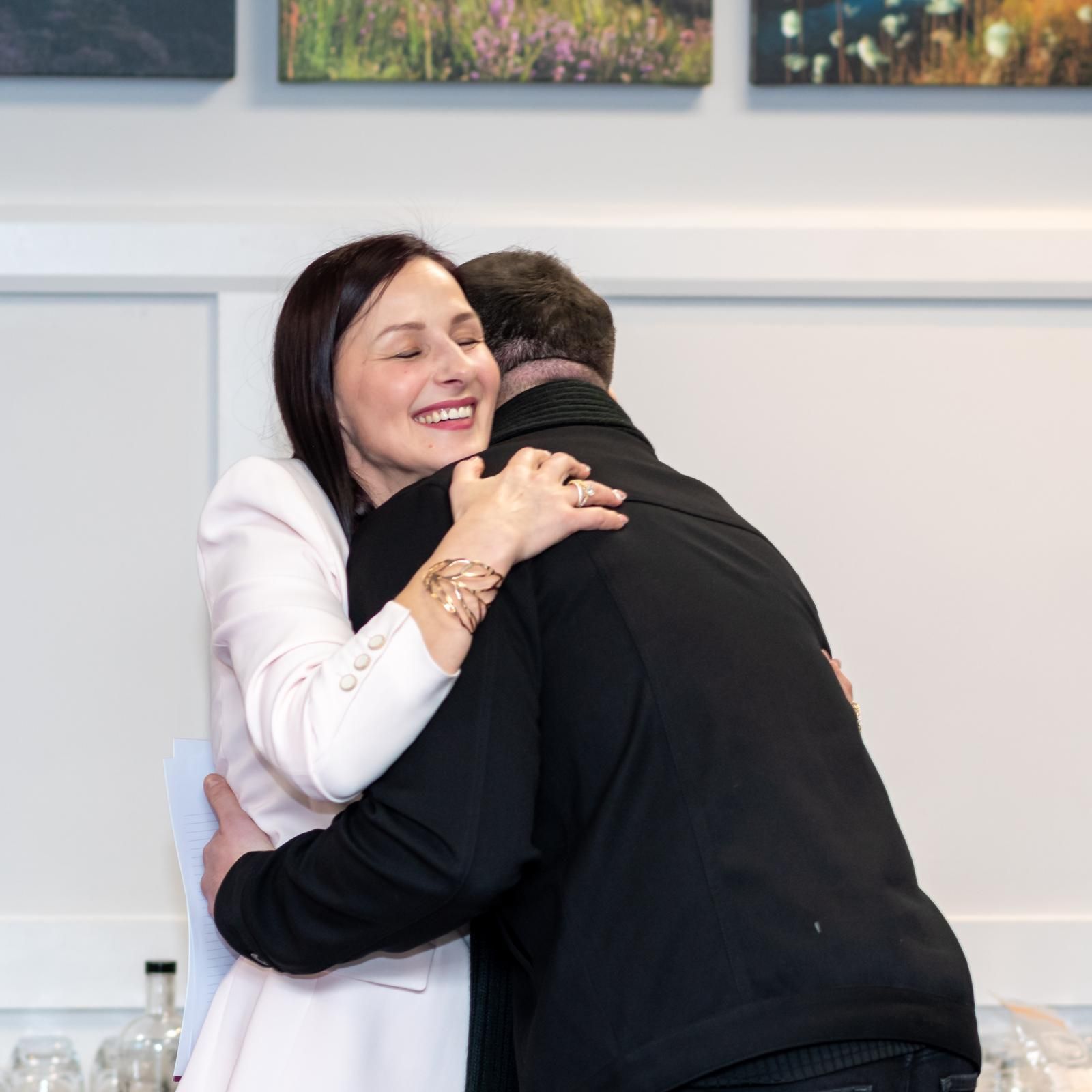 Expert accountant hugging a contractor