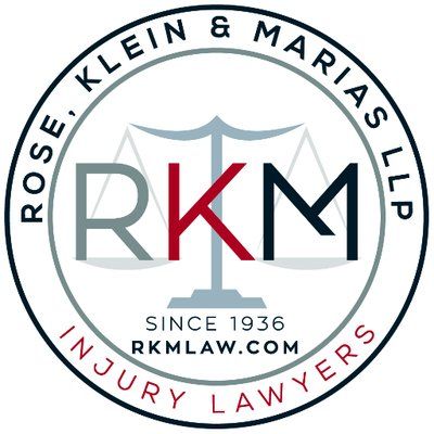 Logo for Rose, Klein & Marias LLP, showing the acronym RKM in a circle with a scale of justice, founded in 1936.