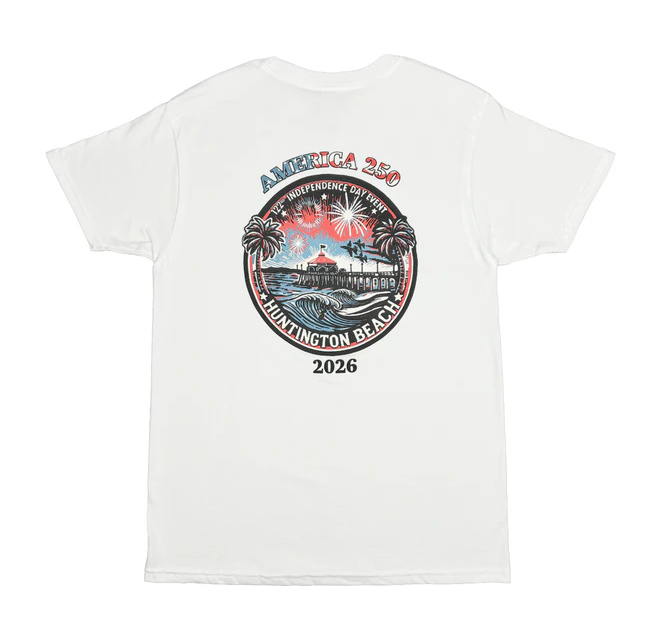 White t-shirt with a Huntington Beach 2026 design featuring fireworks, a pier, and palm trees in red, white, and blue.