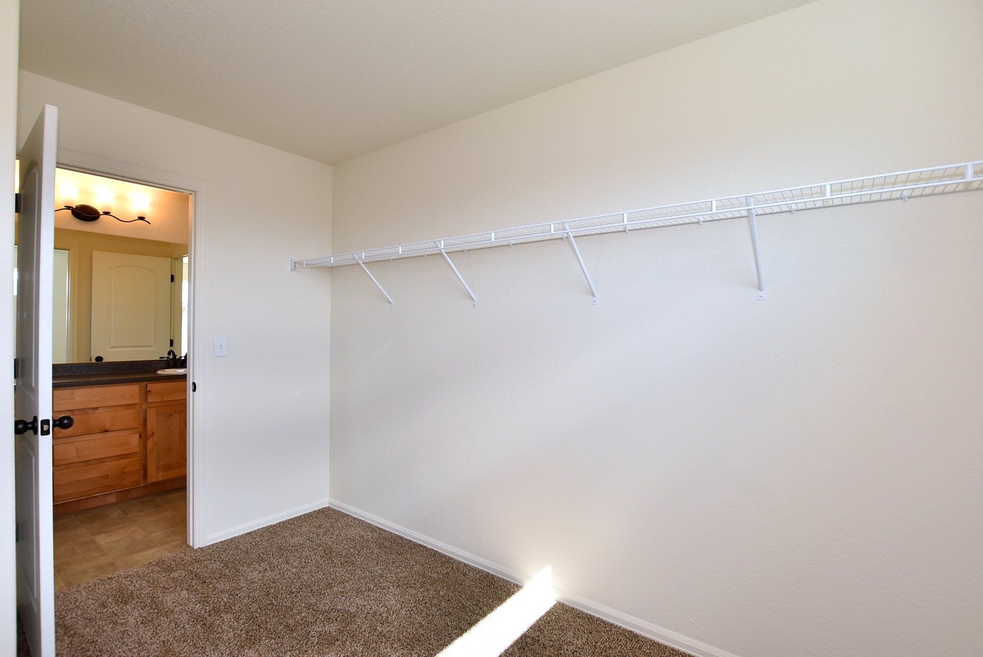 Large walk in closet with shelves