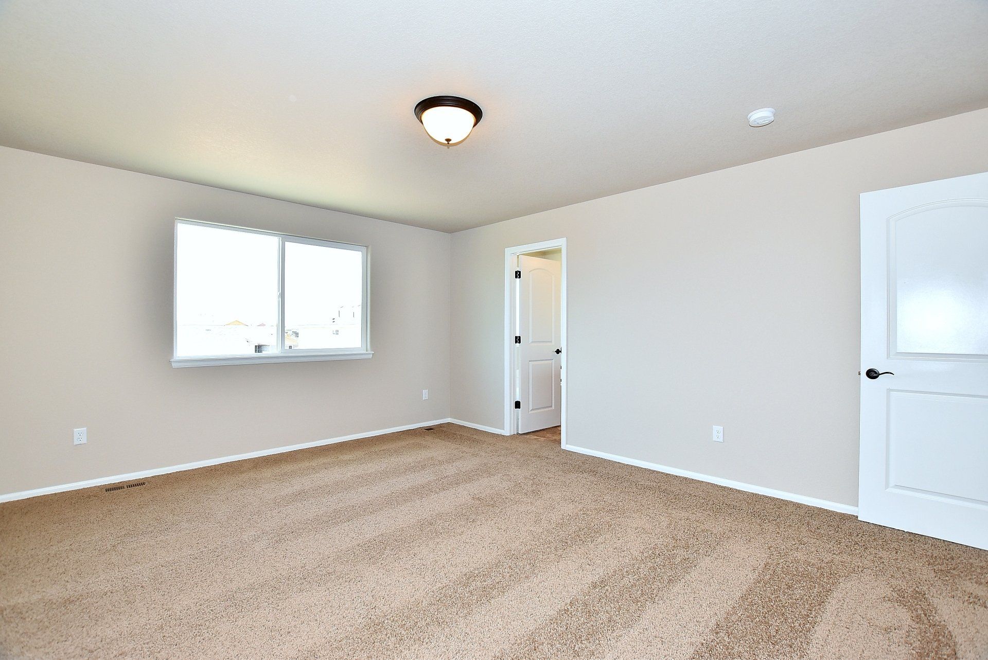 Large room with carpet flooring