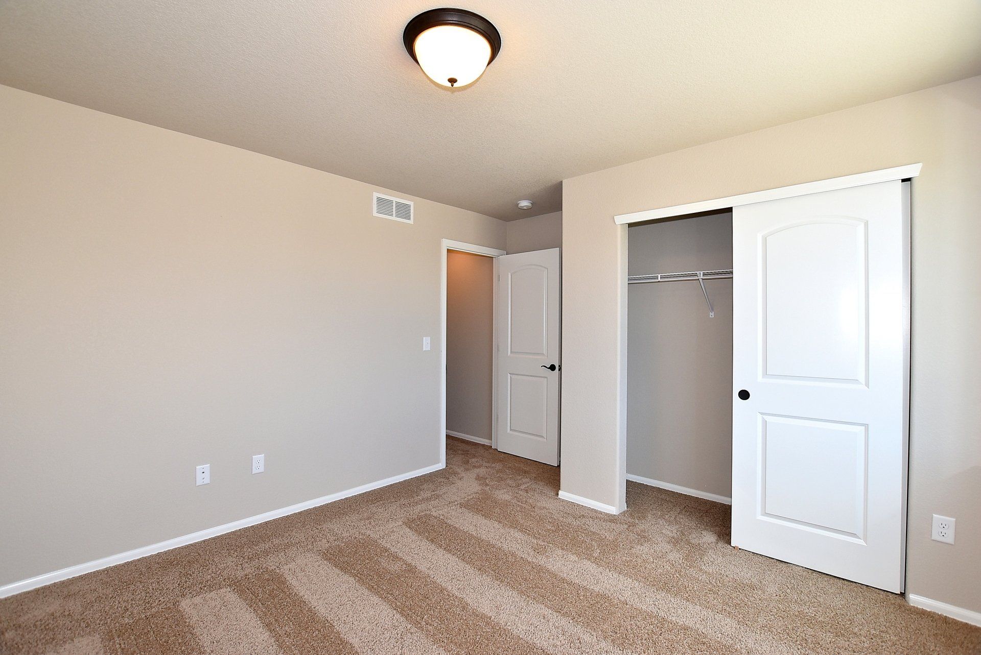 Room with a closet and doorway