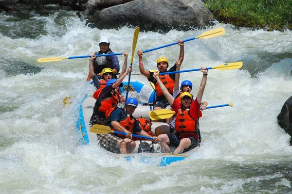 A group of people are rafting down a river.