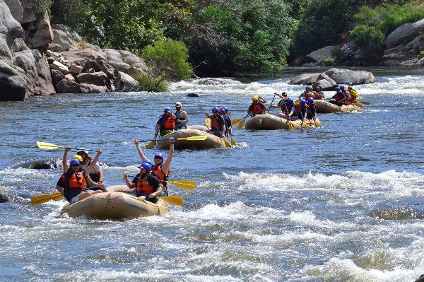 A group of people are rafting down a river.