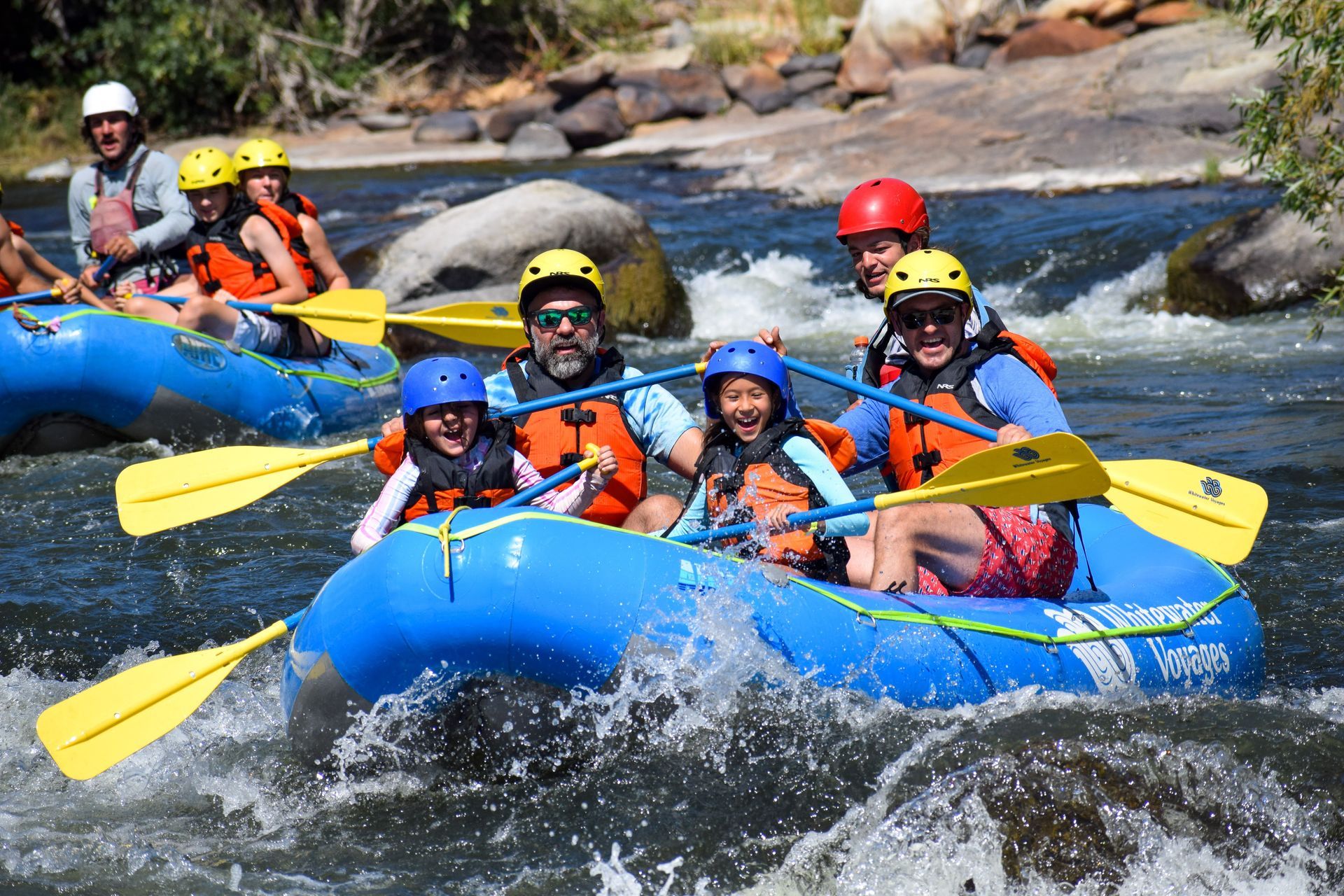 A group of people are rafting down a river.