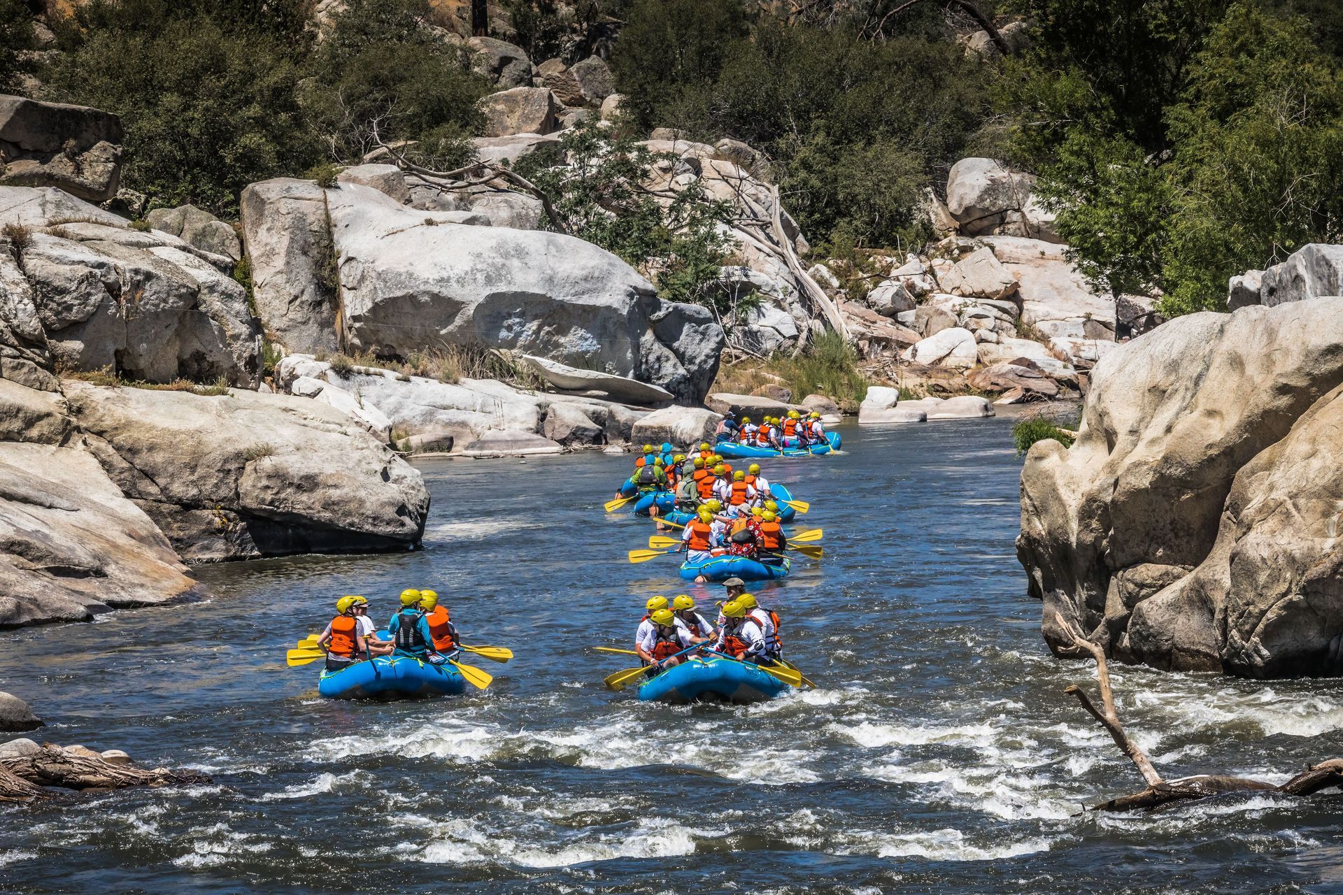 A group of people are rafting down a river.