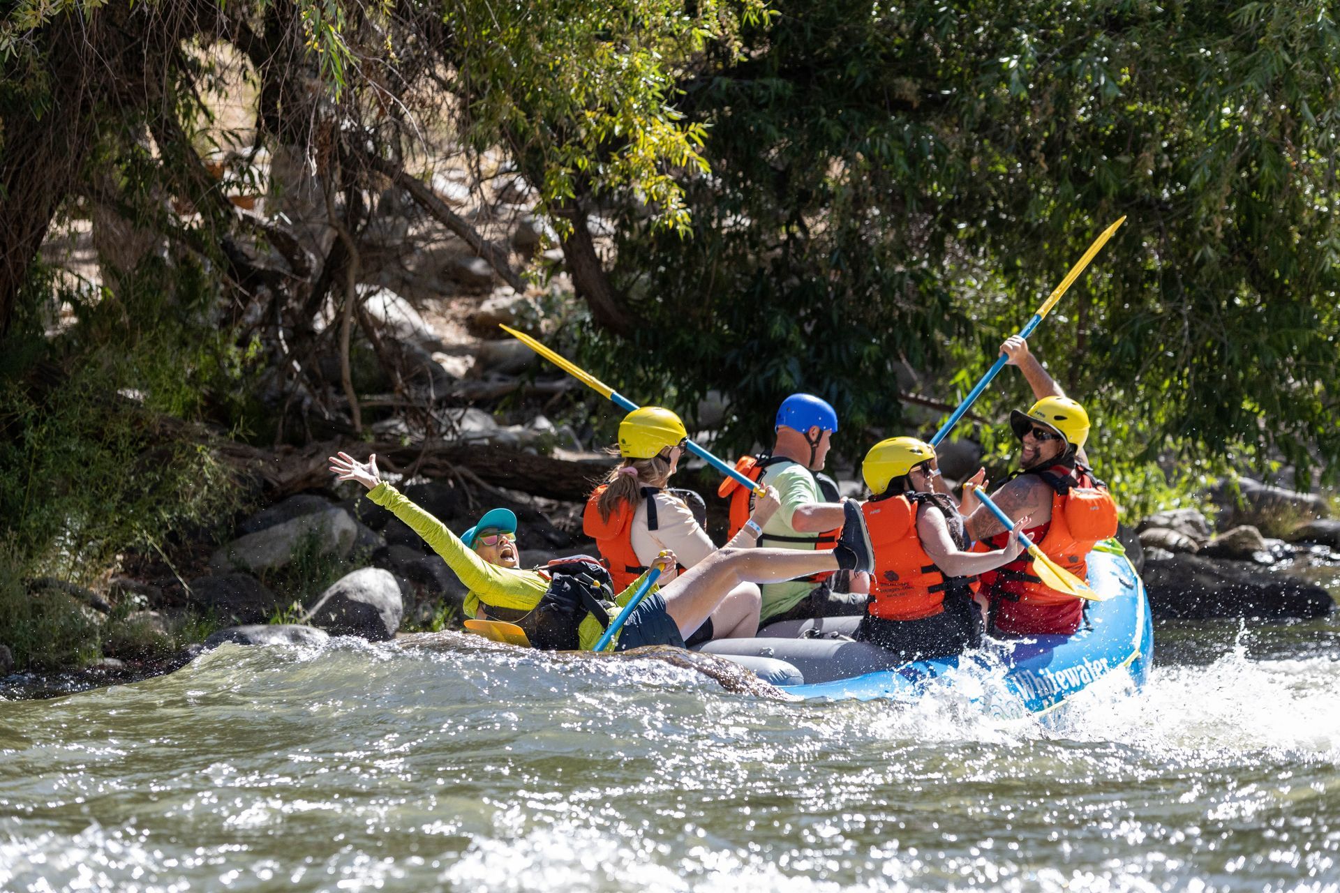 A group of people are rafting down a river.