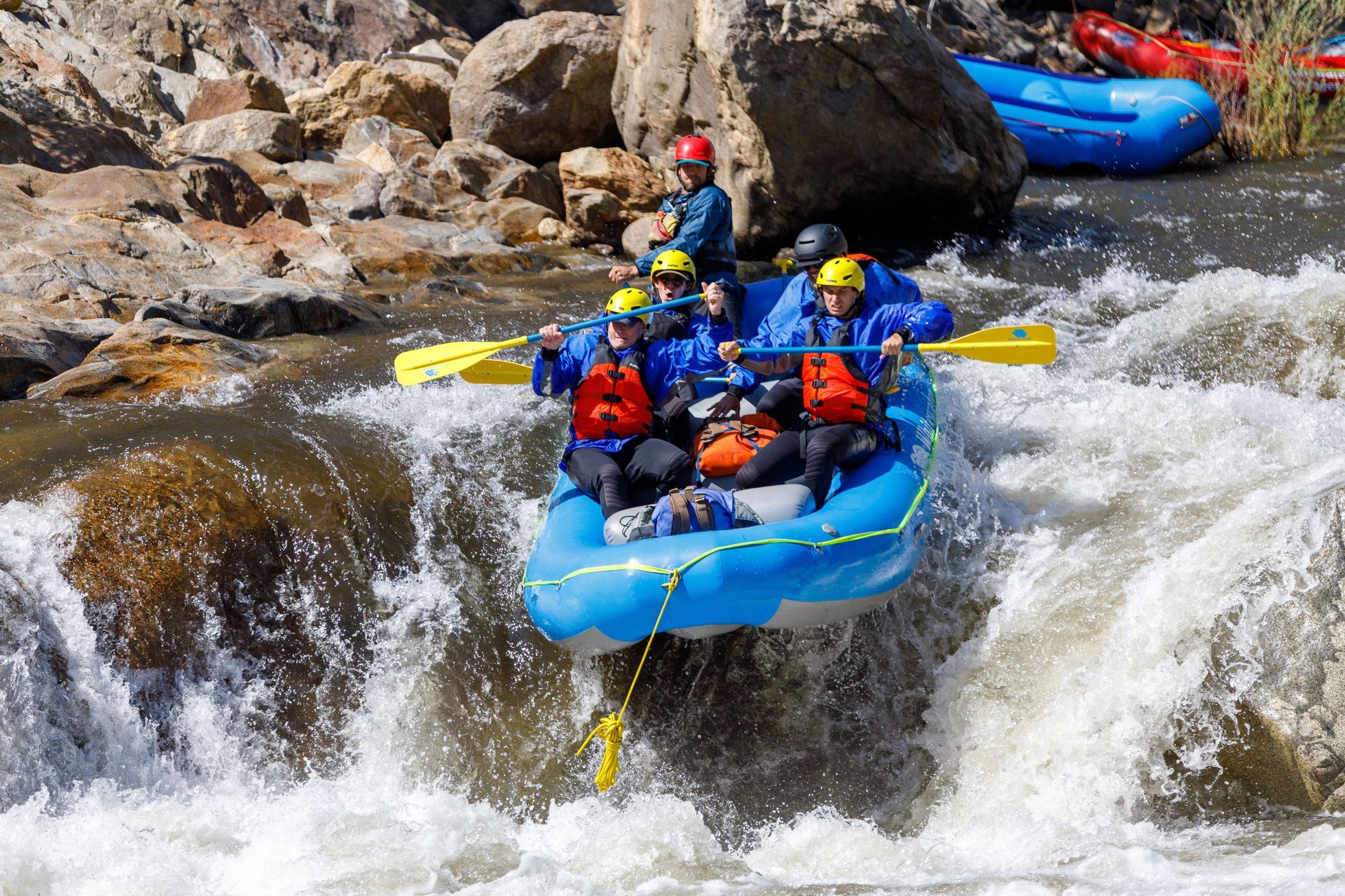 A group of people are rafting down a river.