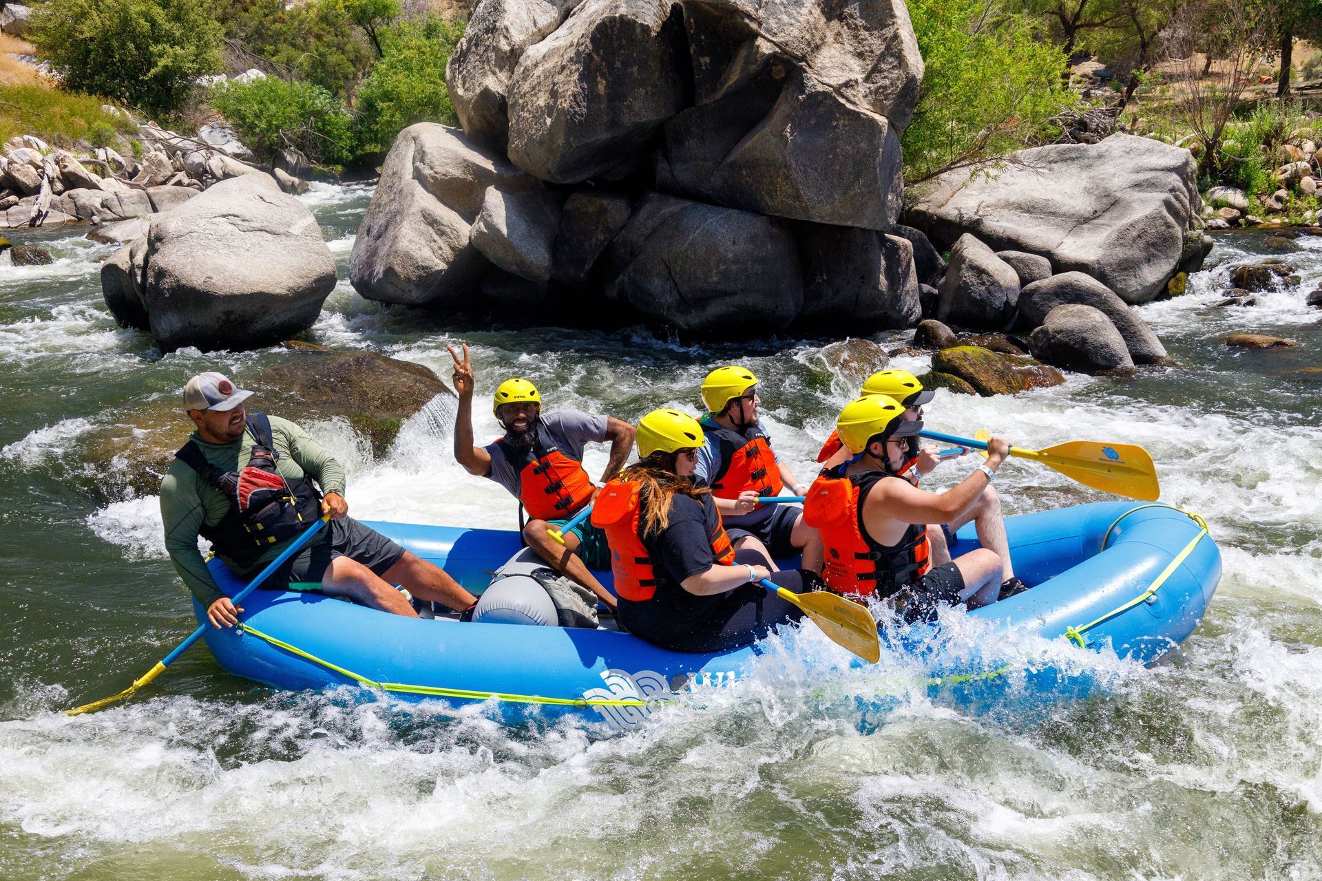 A group of people are rafting down a river.