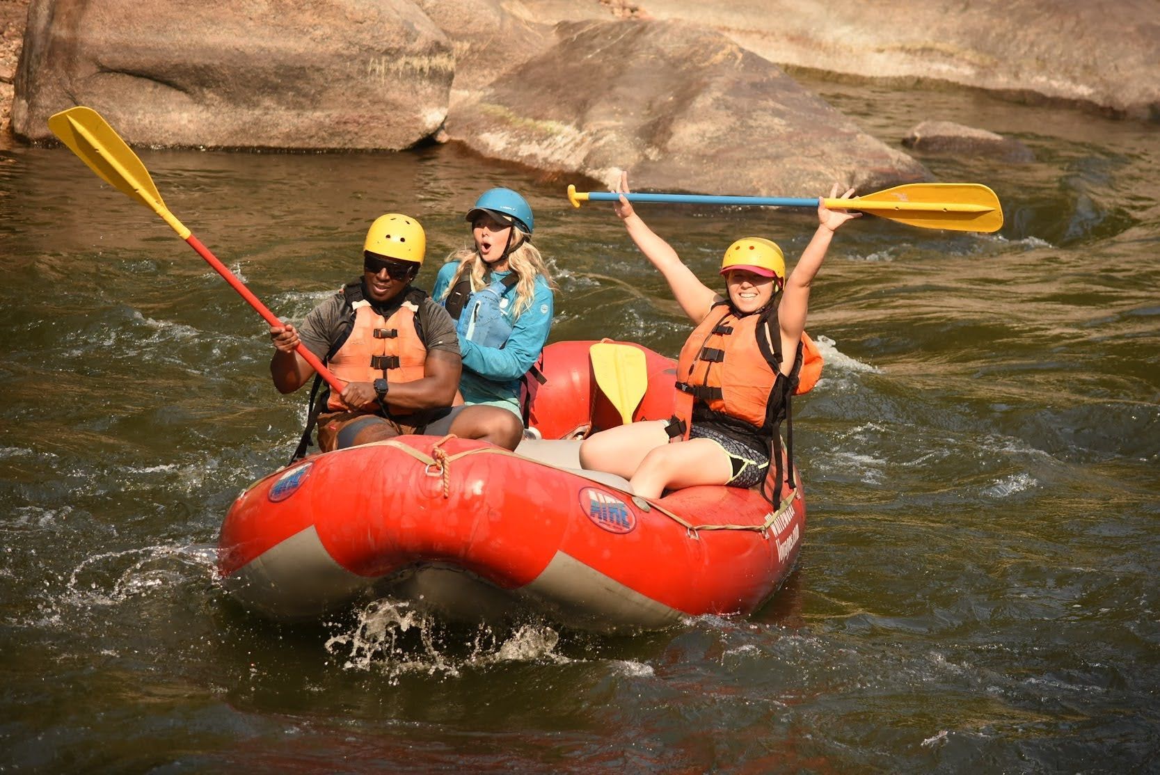 A group of people are rafting down a river.