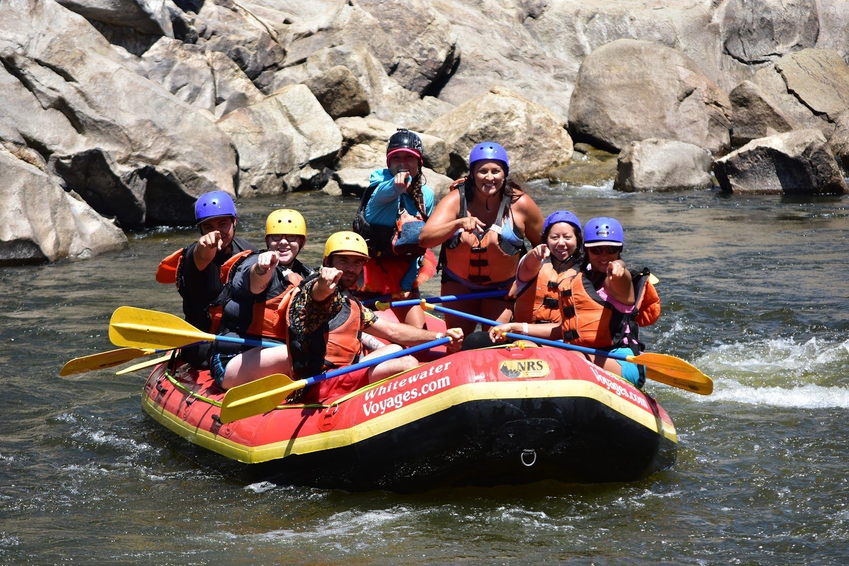A group of people are rafting down a river.