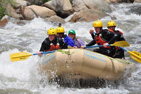 A group of people are rafting down a river.
