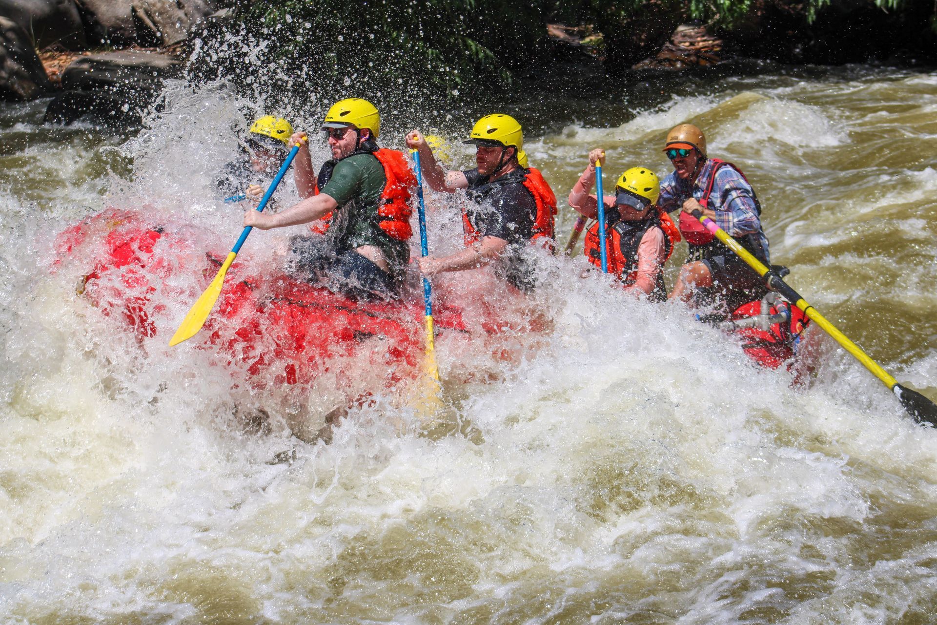 A group of people are rafting down a river.