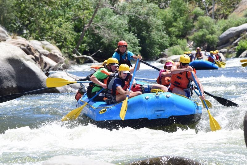 A group of people are rafting down a river.