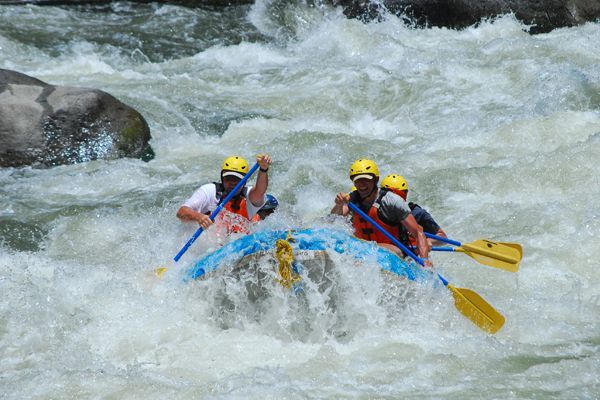 A group of people are rafting down a river.