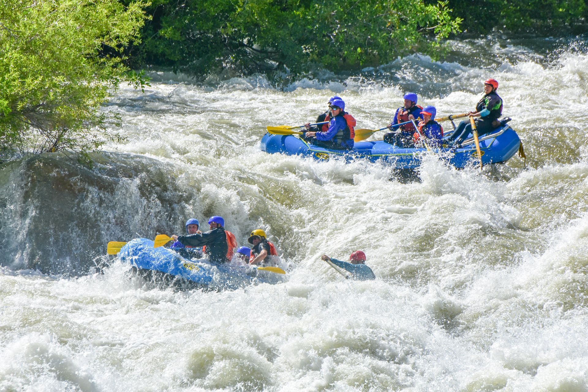 strong rapids with three rafts