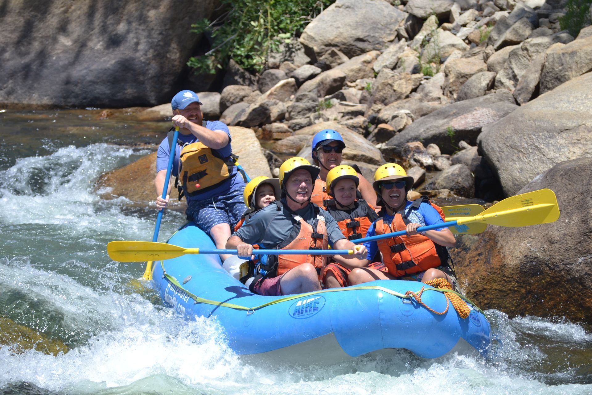 A group of people are rafting down a river.