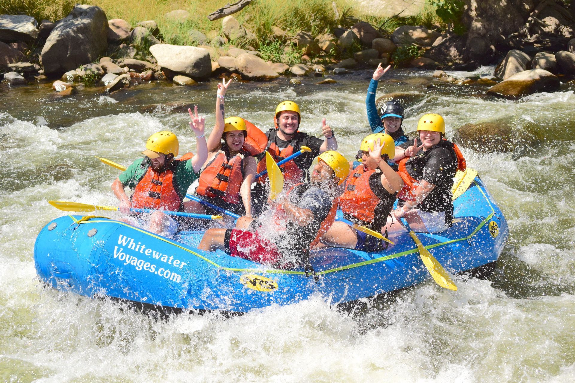 A group of people are rafting down a river.