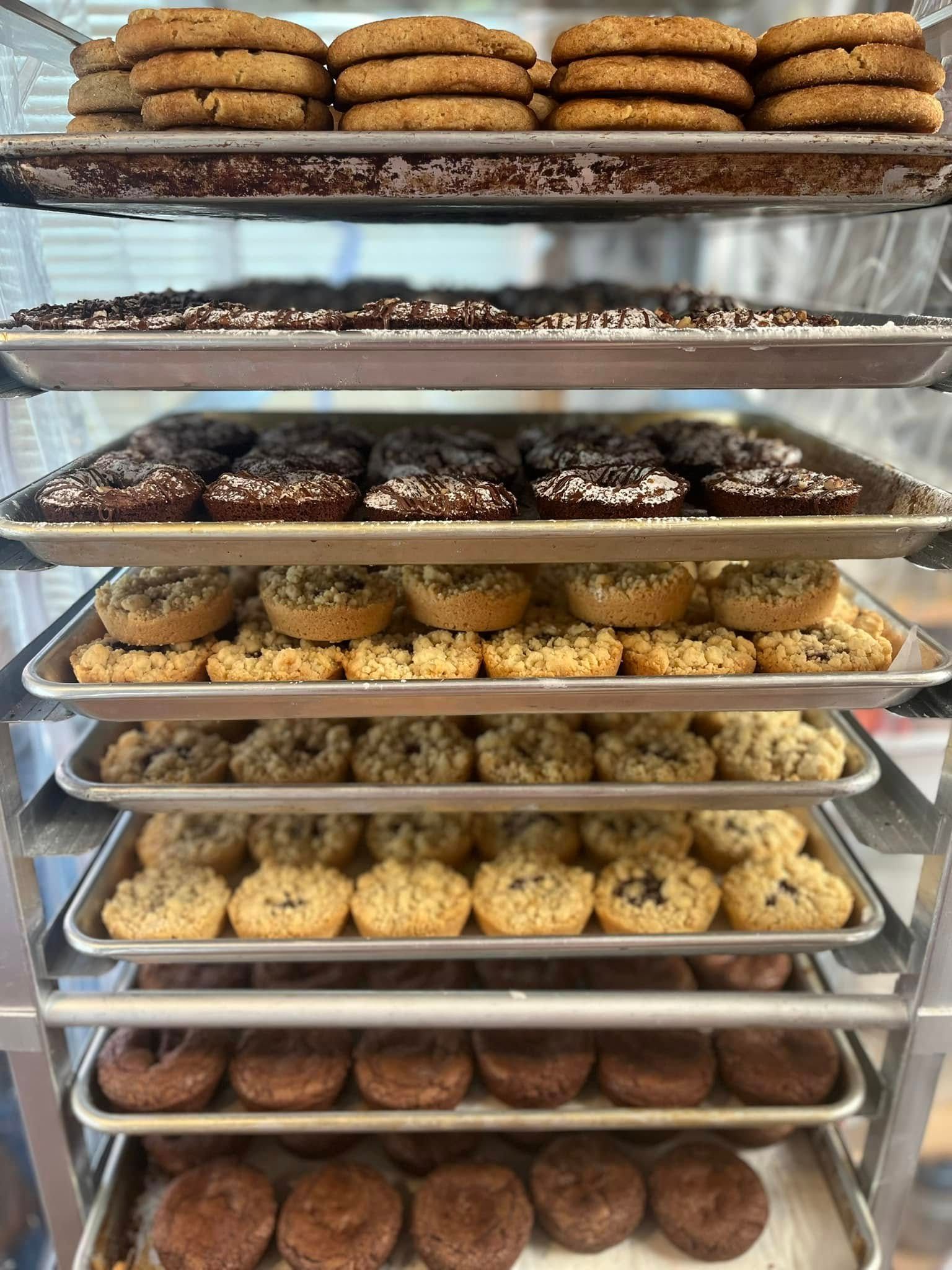 Shelves stacked with various cookies and baked goods in a bakery. Base Camp Bakery Gunnison, Colorado https://share.google/AgqUzUKNzsb0ThlP5, https://www.facebook.com/BaseCampBakery1, https://www.instagram.com/basecampbakery_81230