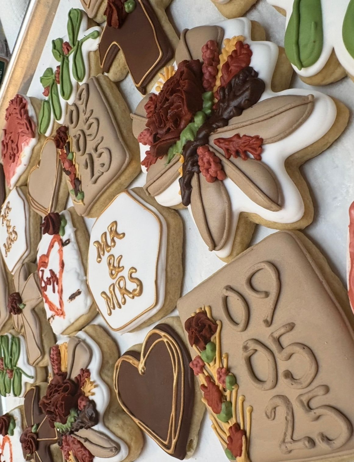 Decorated sugar cookies with wedding theme: dates, florals, 