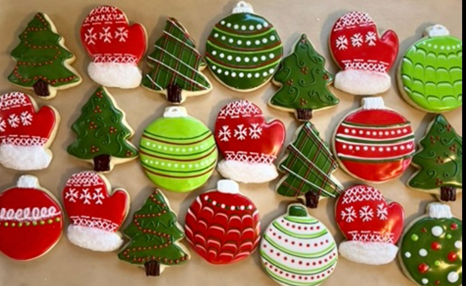 Christmas cookies: trees, mittens, and ornaments decorated with red, green, and white icing.