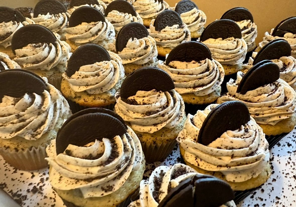 Cupcakes with swirl frosting, Oreo cookie garnish; close-up shot.