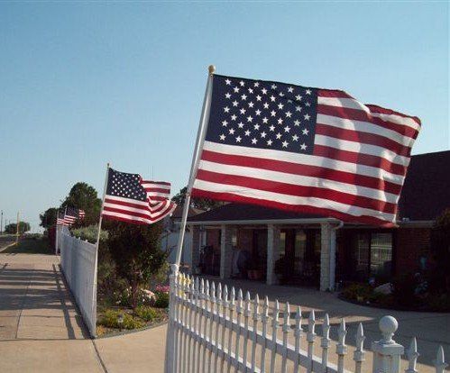 Flags waving in front of home