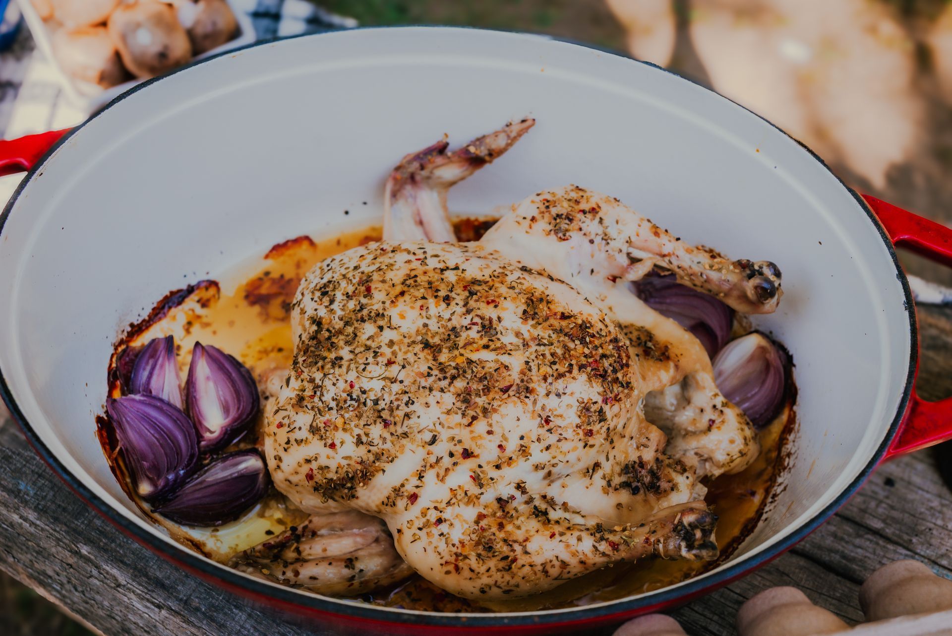 Plate of crispy bacon on a wooden surface, with bags of pork products in the background.