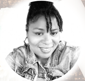 A black and white photo of a woman wearing a denim jacket