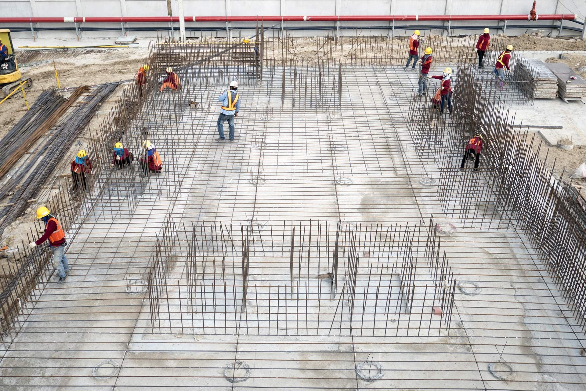 Concrete contractors preparing a construction site for concrete