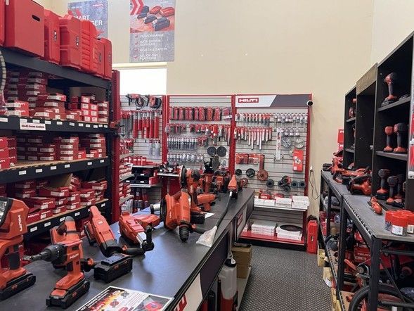 Hilti Tools showroom featuring professional power tools, drills, accessories, and hardware on display