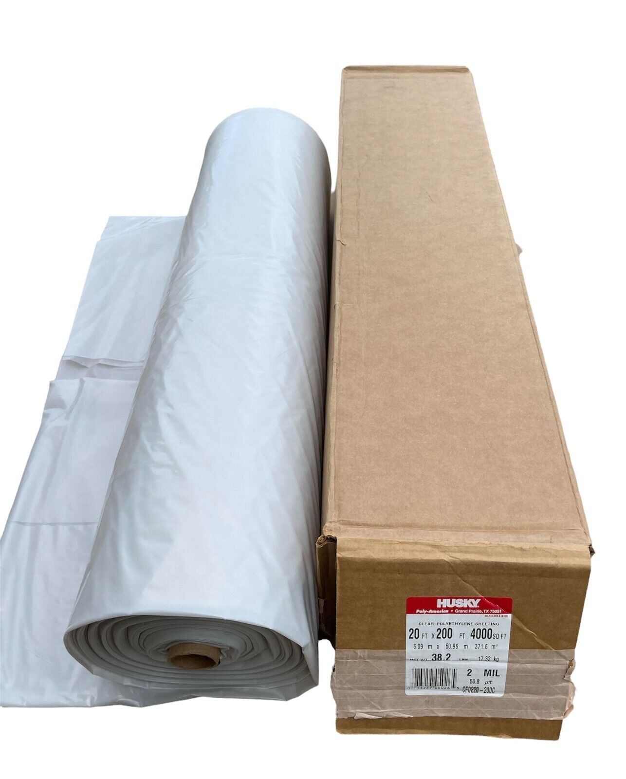 A roll of plastic wrap is sitting on a table.