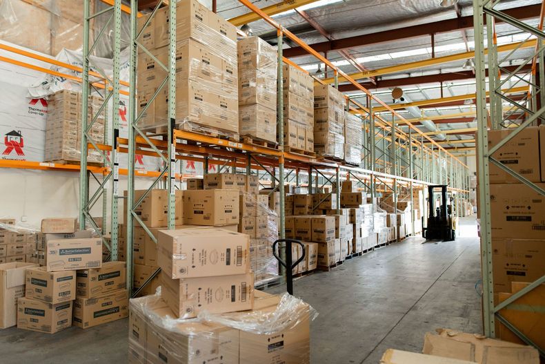 Boxes stacked up in a warehouse.