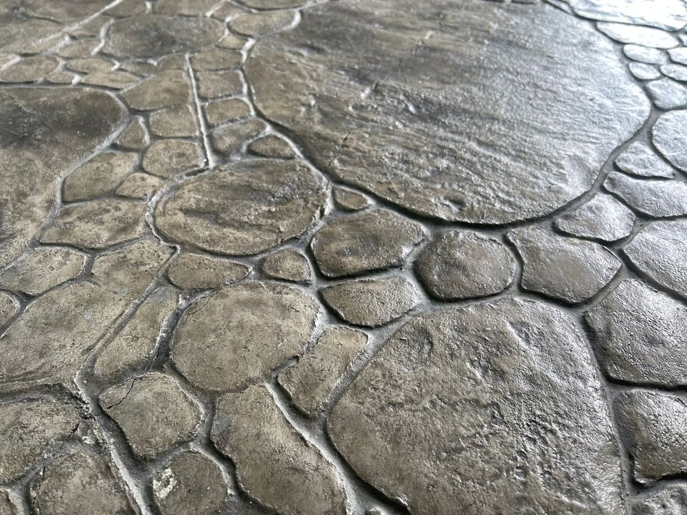 A close up of a concrete floor that looks like rocks.