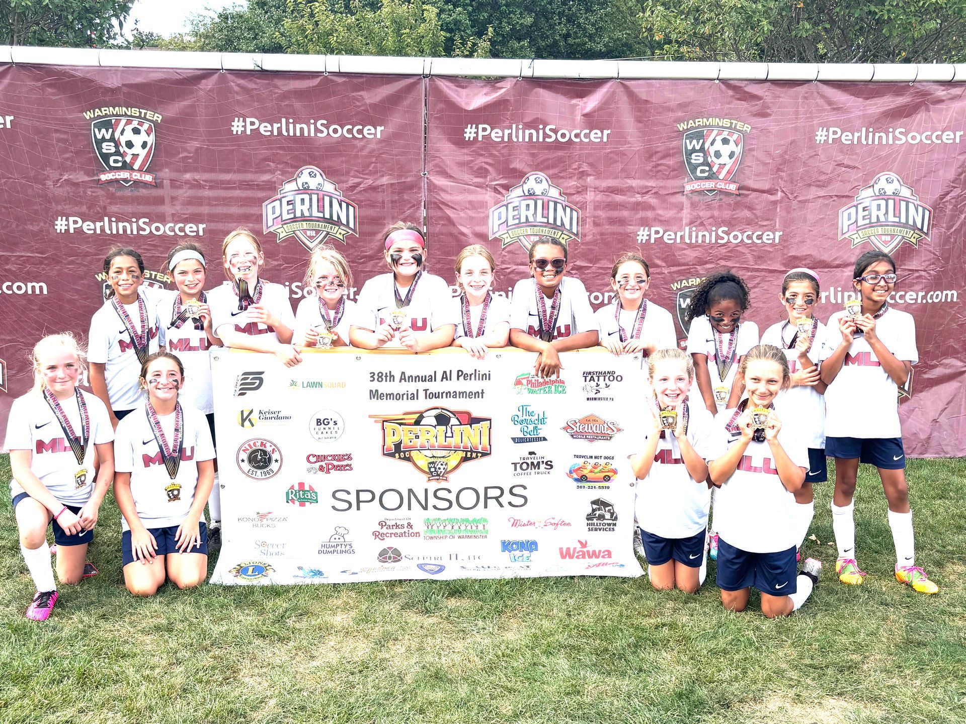 Mount Laurel United Soccer team with medals