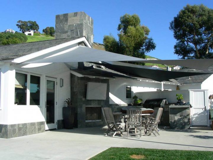 A Patio With A Table And Chairs Under A Canopy — Shades of Blue In North Wyong, NSW