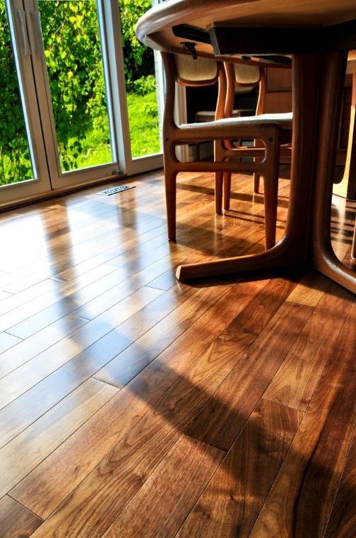 Close-up image of hardwood floors in a dining room in Virginia Beach home