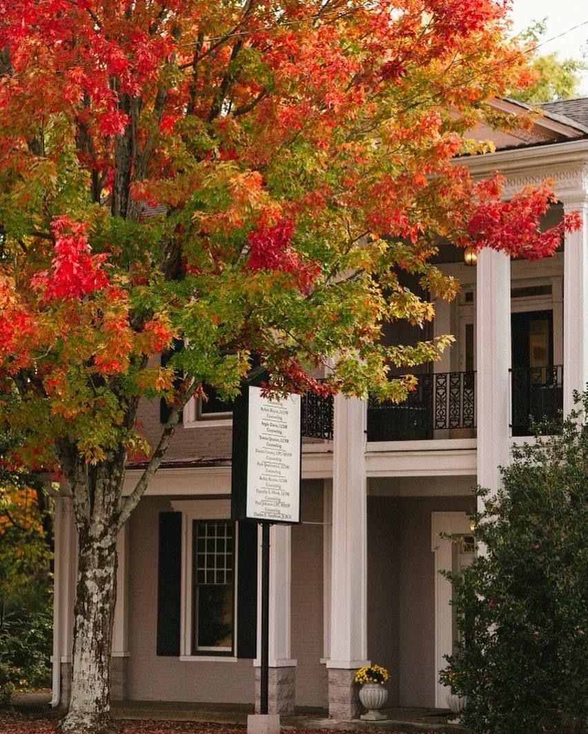 A white house with a sign that says welcome on it