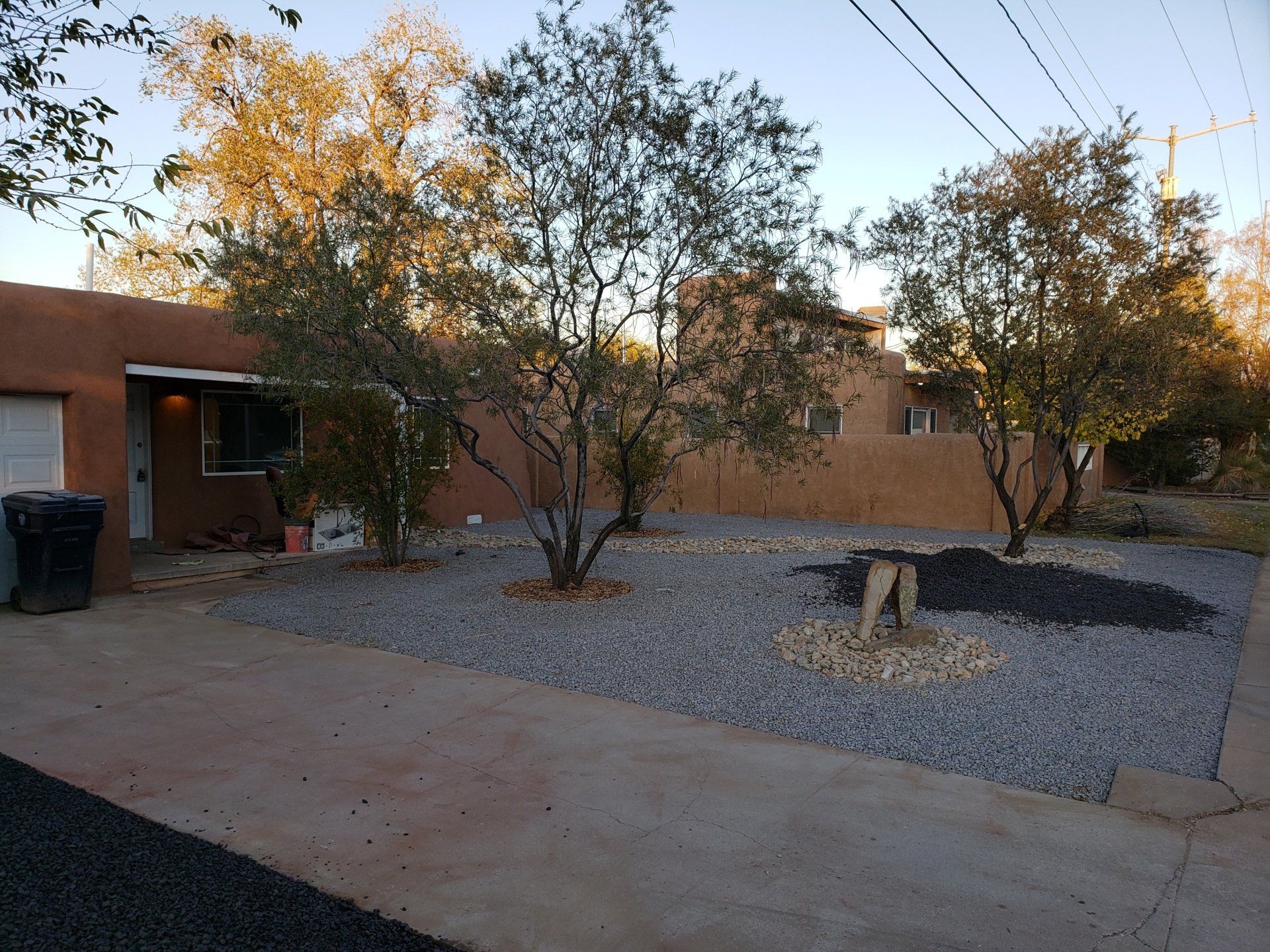 A house with a lot of trees in front of it
