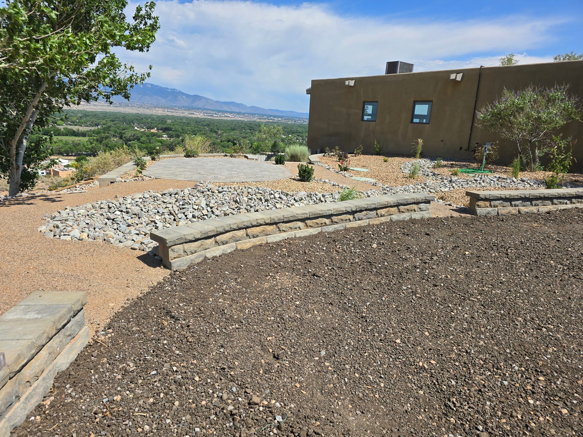 A large house with a lot of rocks in front of it