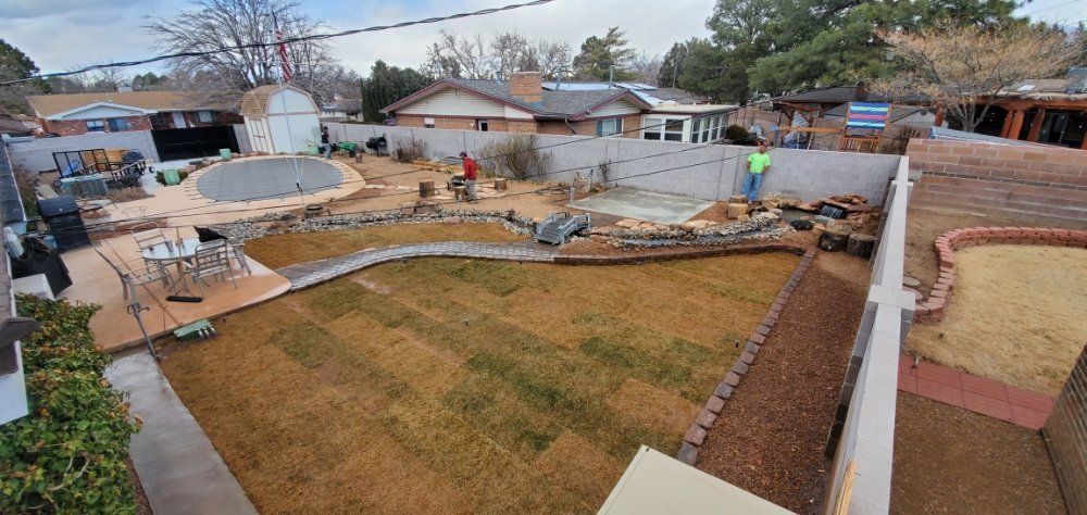 An aerial view of a backyard with a pool being built.