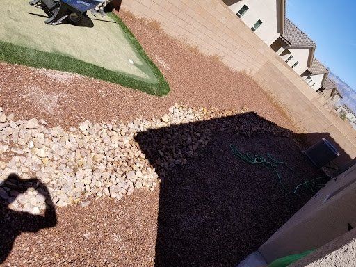 A person is taking a picture of their shadow on the ground