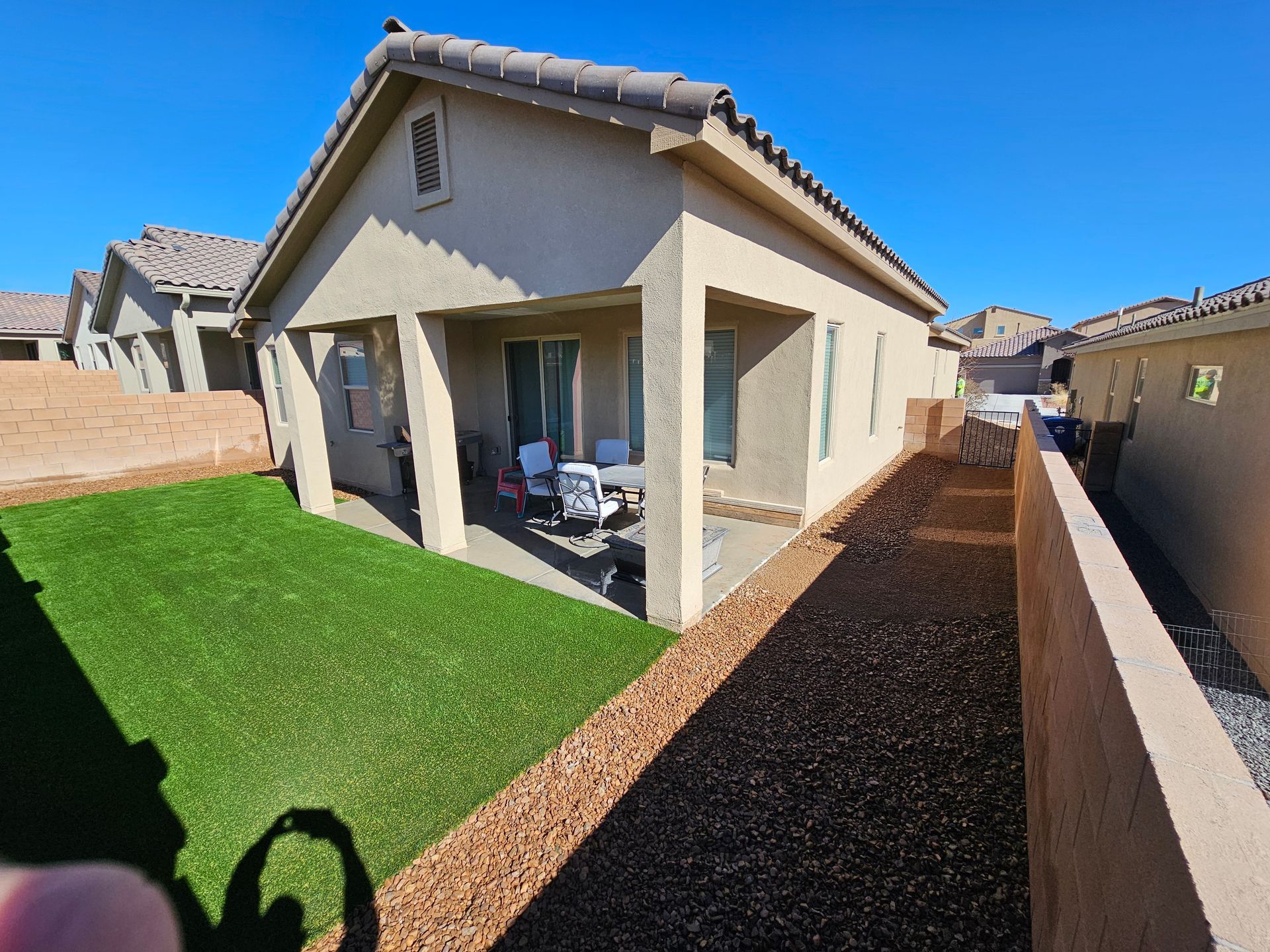 A house with a large lawn in front of it
