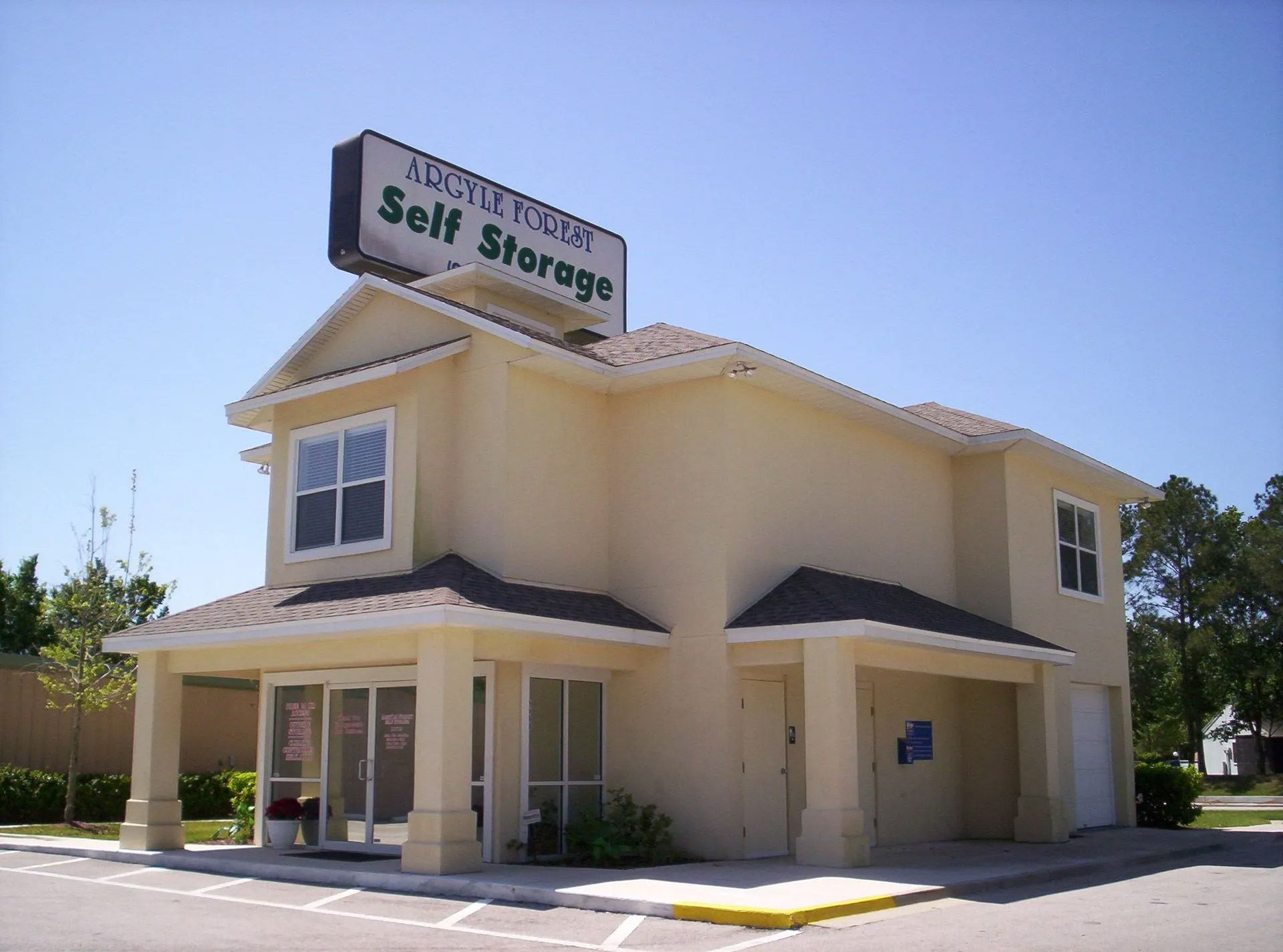 A building with a sign that says self storage on it