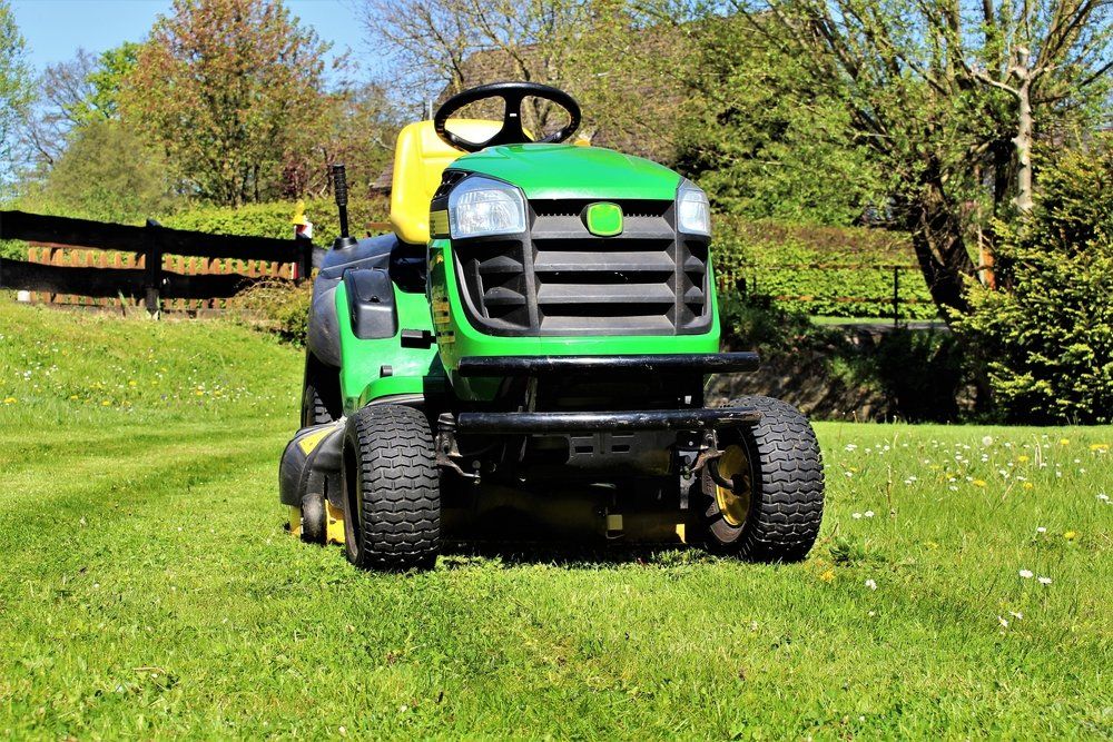 Lawn Mowing Tractor — Commercial Properties in Darling Downs Region, QLD