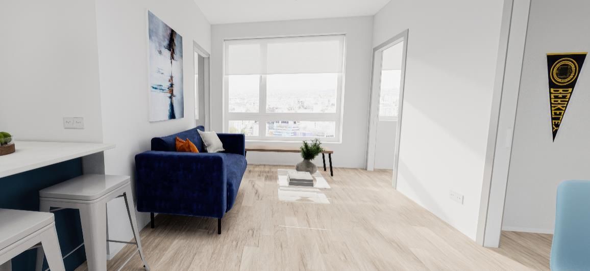 A living room with a blue couch and a blue chair.
