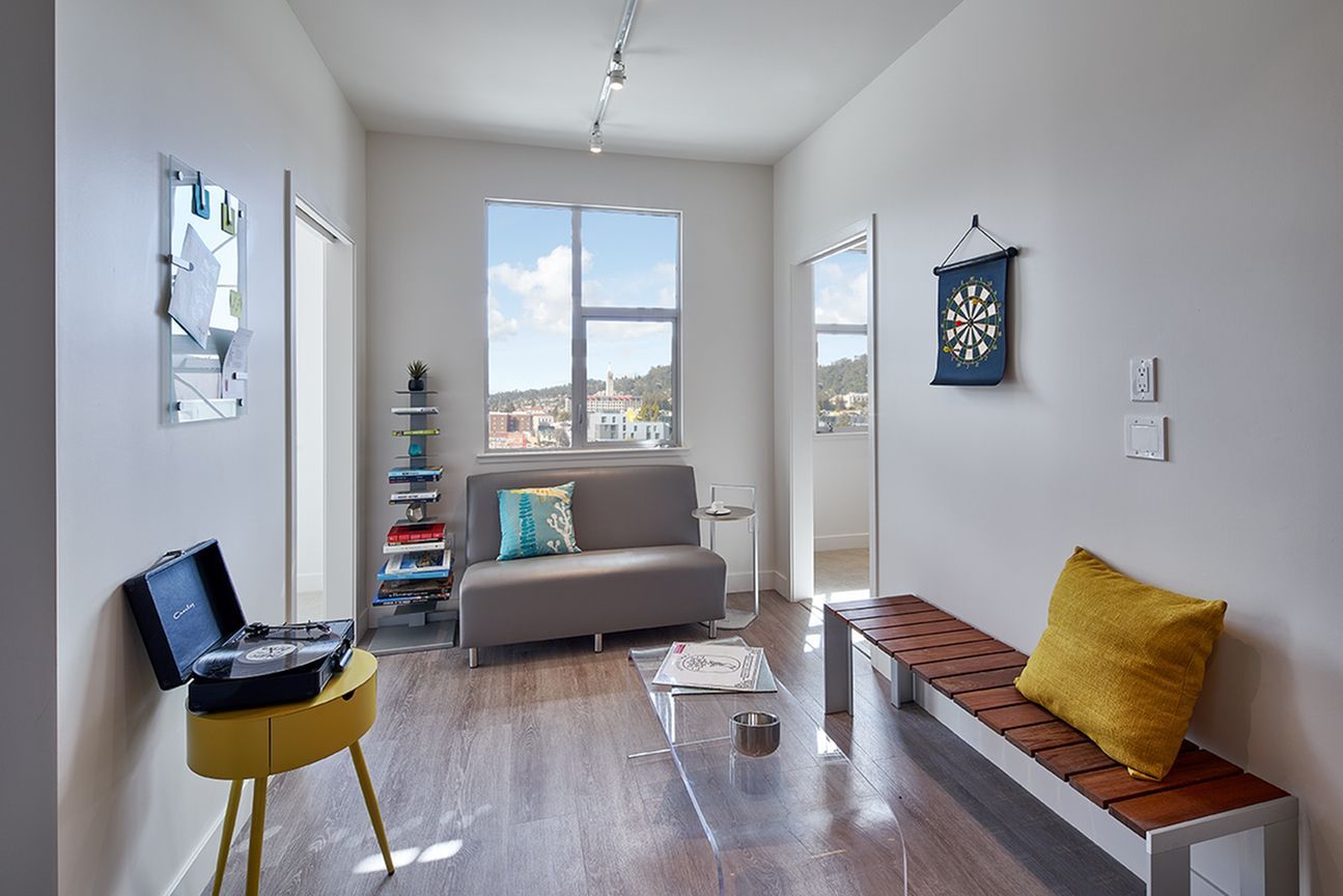 A living room with a couch and a table